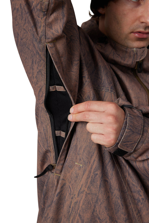 686 Men's Dojo Shell Jacket brown print showing underarm zippered mesh ventilation vent
