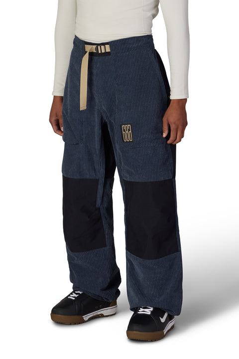 686 men's navy blue corduroy snow pants with black knee patches and tan belt