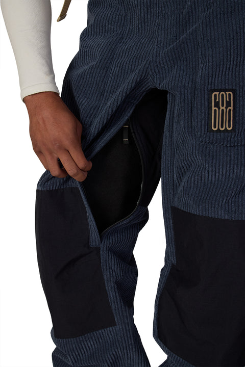686 men's navy corduroy snow pant showing open thigh ventilation zip pocket detail