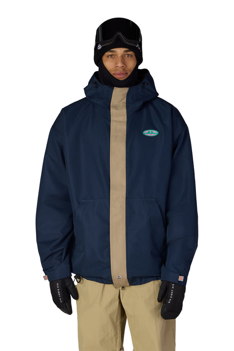 686 Men's 1994 Liberty navy snowboard jacket with tan center stripe and hood