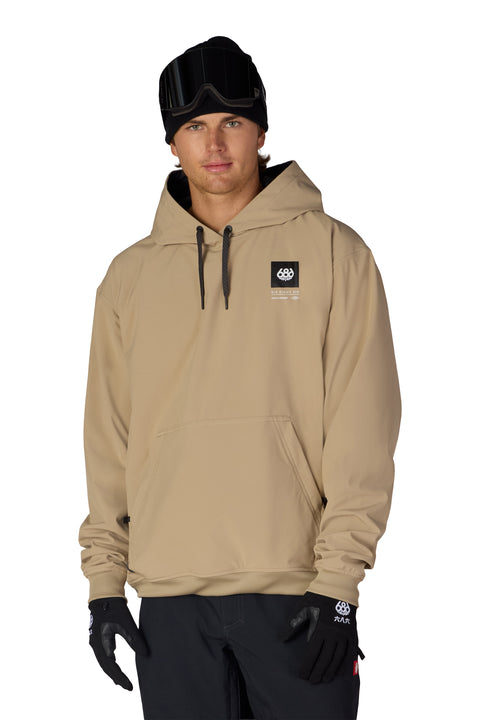 686 men's tan waterproof pullover hoodie with black logo patch and kangaroo pocket