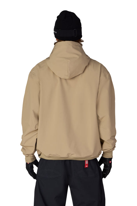 686 Men's Waterproof Team Hoodie in tan, back view, with black pants