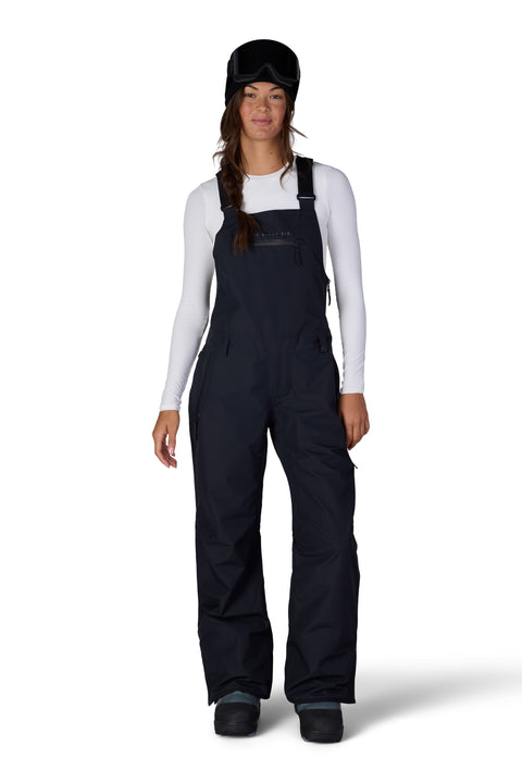 686 Women's Regalia Bib Pant in black with adjustable straps and cargo pockets