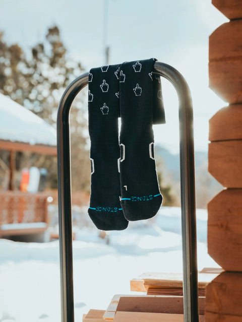 Stance black snowboard socks with white middle finger cursor pattern, teal heel stripe