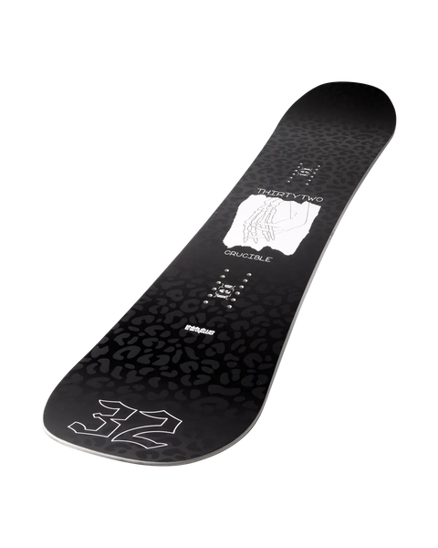 ThirtyTwo Crucible snowboard with black leopard print topsheet and skeletal hand graphic