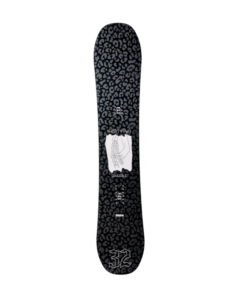 ThirtyTwo Crucible snowboard with black leopard print base and skeletal hand graphic