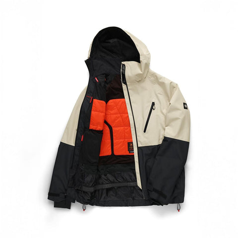 686 men's ski jacket open to reveal quilted orange interior lining and multiple pockets