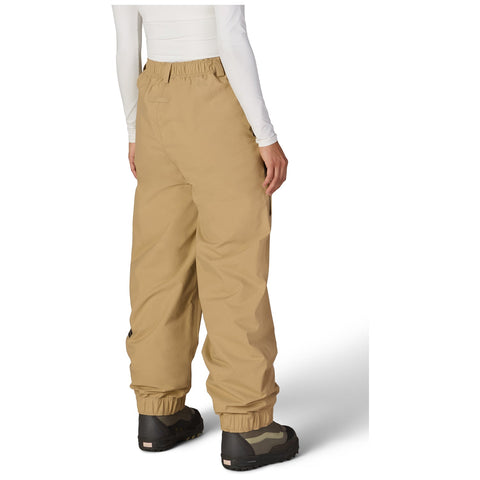 Back view of women's Gore-Tex snow pants with elastic waist and cuffed ankles on model