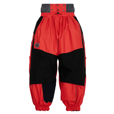 Kids red and black two-tone shell snow pants with elastic cuffs and waistband