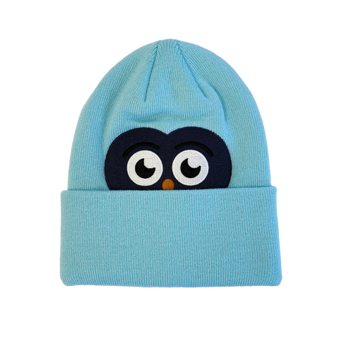 Light blue knit youth beanie with embroidered cartoon owl face peeking over cuff