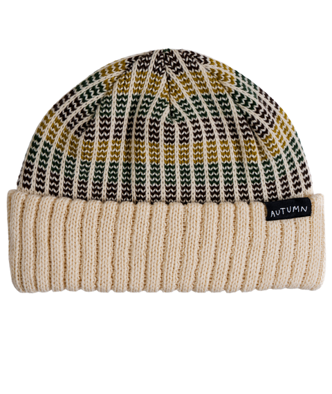 Autumn Riddim cream ribbed knit beanie with green, gold, and brown striped pattern