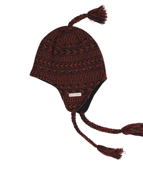 Autumn Swell Ear Flap Beanie in black and rust red Aztec knit pattern with braided tassels