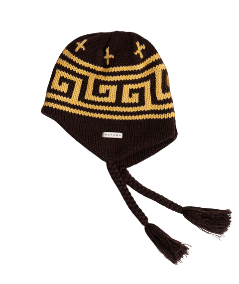Autumn Niseko dark brown knit ear flap beanie with gold Greek key pattern and braided tassels