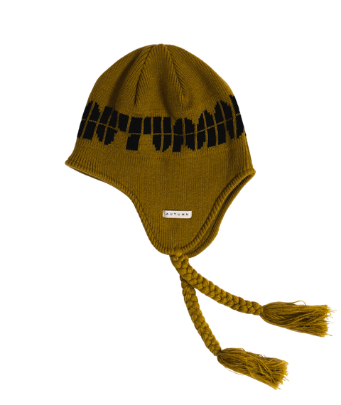 Autumn mustard yellow ear flap beanie with black pattern and braided tassel ties