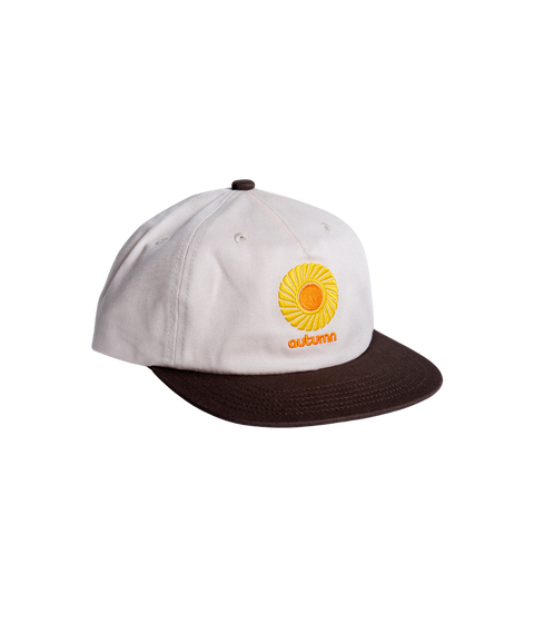 Autumn cream and brown two-tone snapback cap with embroidered sun logo