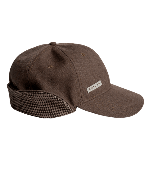 Autumn brown washed canvas baseball cap with houndstooth earflap and logo patch