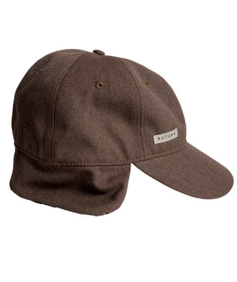 Autumn brown washed canvas baseball cap with ear flap and small logo patch