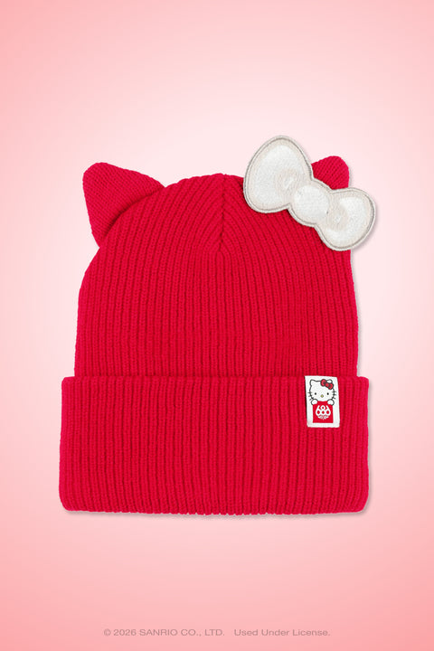 Red ribbed knit beanie with cat ears, white bow patch, and Hello Kitty label