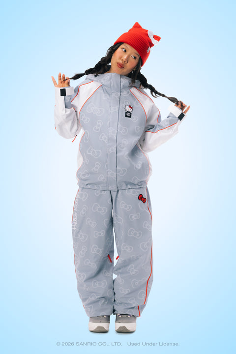 Women's gray Hello Kitty print snow jacket with white sleeves and red accents.