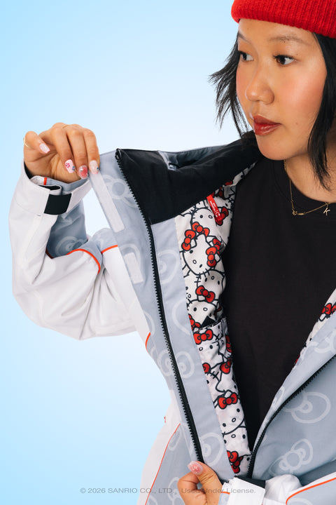 Women's gray Hello Kitty shell ski jacket with red bow lining detail