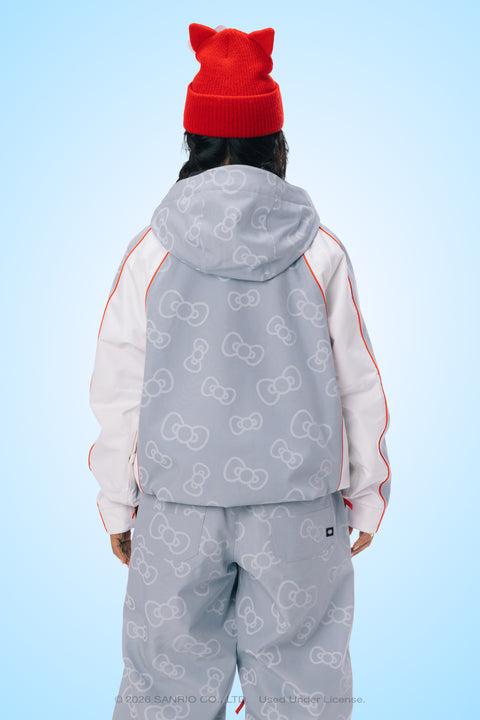 Gray Hello Kitty bow-print ski jacket with white sleeves and red cat-ear beanie, back view