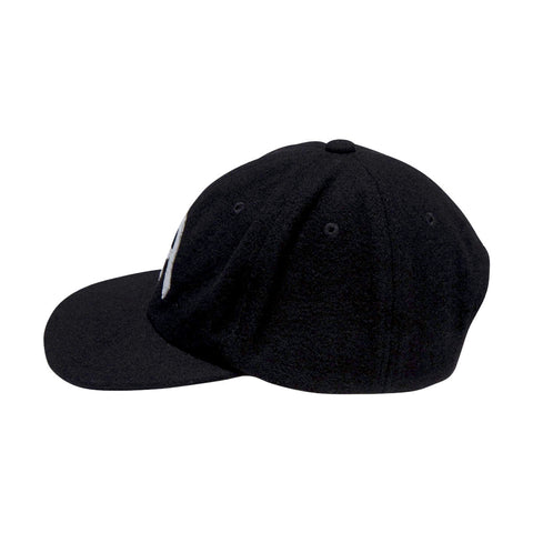 Side view of a black six-panel wool strapback cap with embroidered logo on front