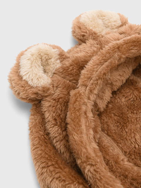 Close-up detail of a kids fleece hood with teddy bear ears and cream inner lining