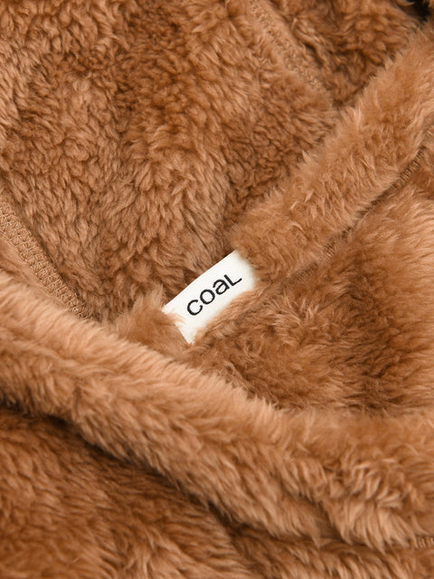 Close-up detail of Coal branded fuzzy fleece hood interior showing label and texture