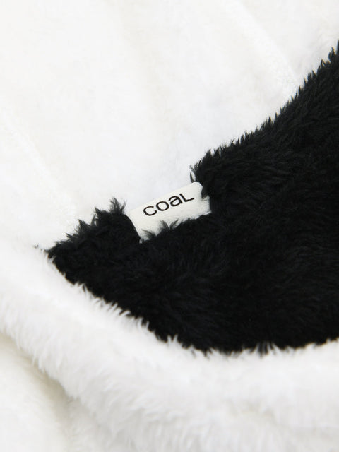 Close-up detail of a black and white fluffy kids hood showing Coal brand label