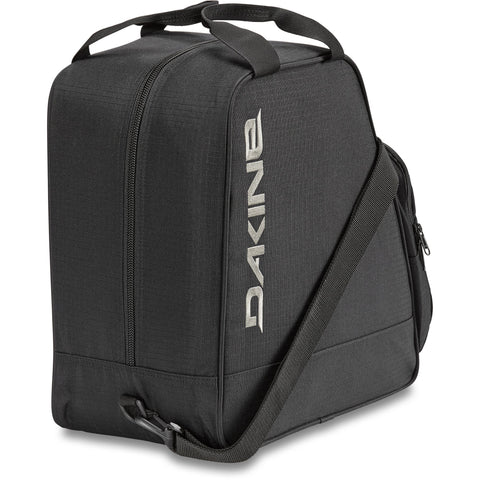 Dakine boot bag with top handle, shoulder strap, and zippered compartments on white background