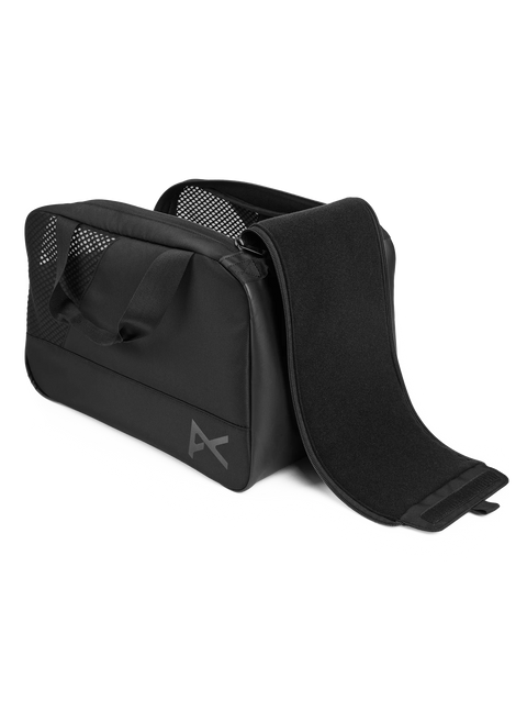 Anon black helmet bag with mesh panels, carry handle, and open zipper compartment