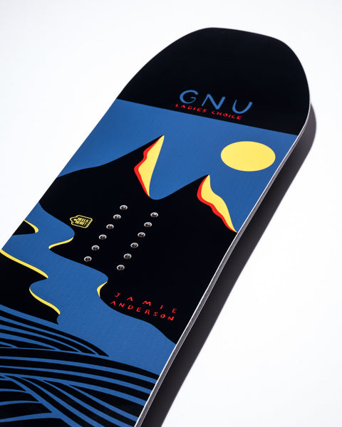 GNU Ladies Choice snowboard featuring bold graphic art with mountains, sun, and Jamie Anderson signature