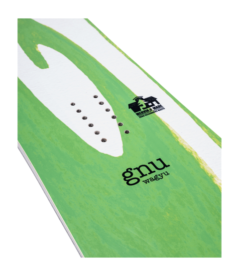 GNU Wagyu snowboard deck detail showing binding inserts, logo, and green graphic design