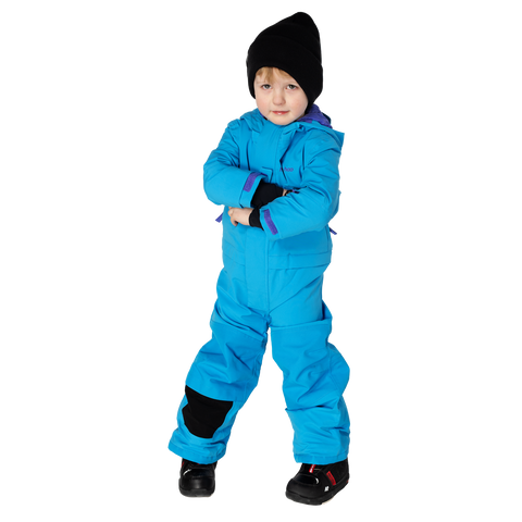 Toddler wearing a bright blue insulated one-piece snowsuit with black accents and winter hat