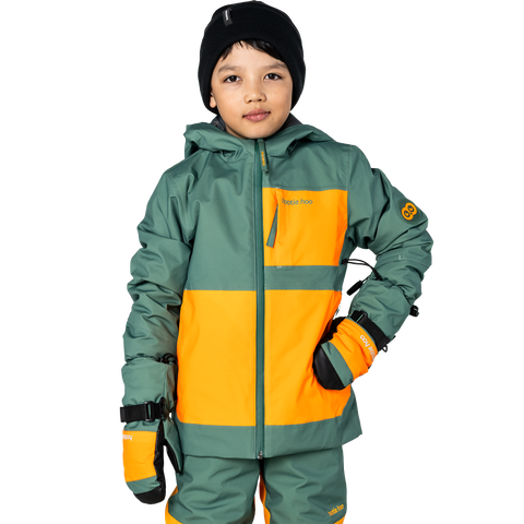 Child wearing a two-tone insulated ski jacket with matching pants, mittens, and black beanie
