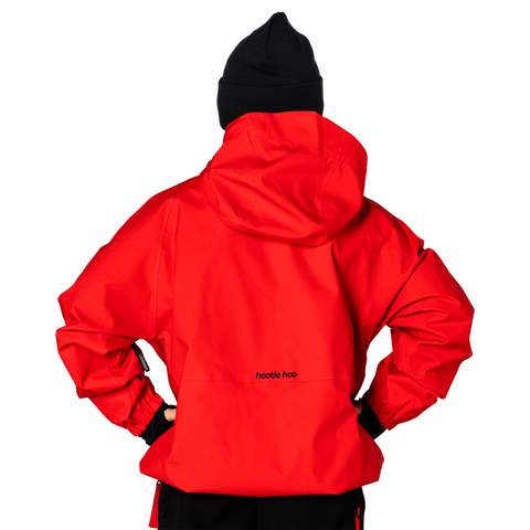 Back view of a red hooded shell jacket with brand logo and black beanie hat