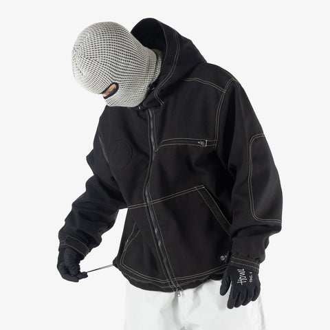 Man wearing black zip-up workwear jacket with contrast stitching, hood, and gloves