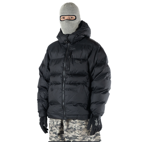 Man wearing Howl puffy hooded down jacket with balaclava and camo pants
