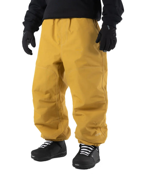 Men's baggy snowboard pants in workwear style with elastic cuffs and gloves