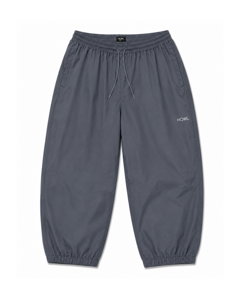 Howl men's relaxed-fit parachute pants with elastic waist, drawstring, and cuffed ankles
