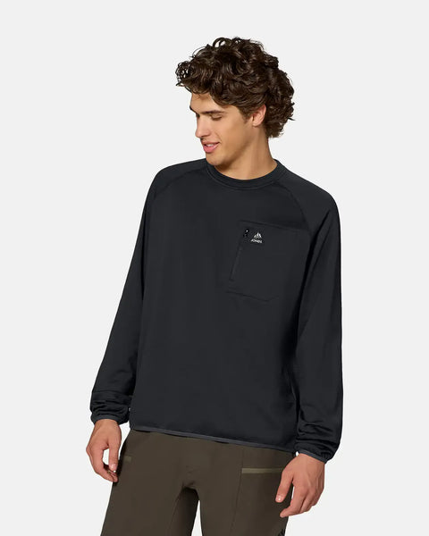 Man wearing a black long-sleeve crew fleece pullover with chest zip pocket and raglan sleeves