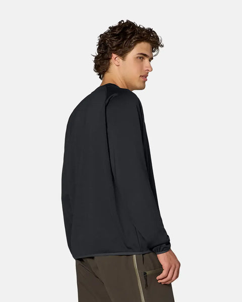 Men's black crew fleece pullover shown from back-side angle on male model