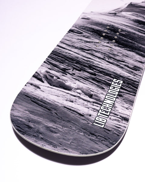 Lib Tech snowboard tail detail showing black and white textured graphic design with binding inserts
