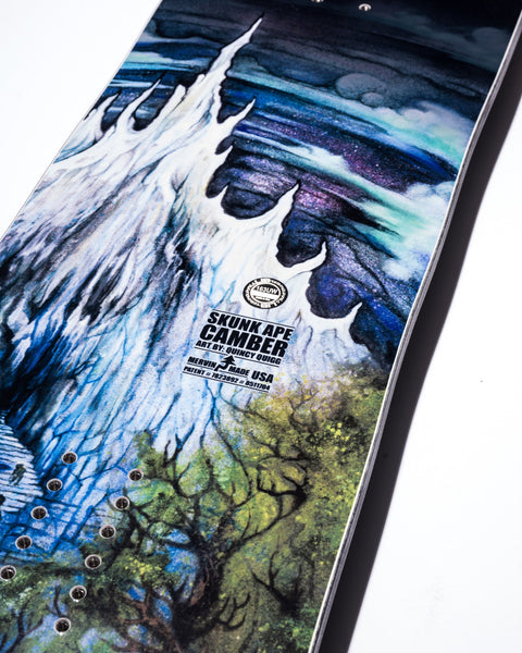 Lib Tech Skunk Ape Camber snowboard base featuring vivid Bigfoot forest artwork by Quincy Quigg