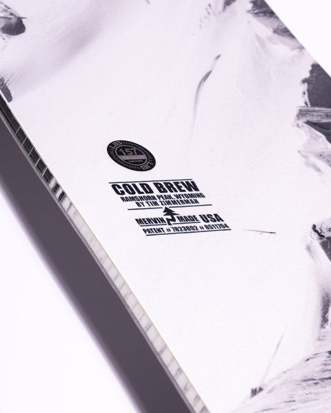Close-up detail of Lib Tech Cold Brew snowboard base showing Mervin Made USA branding and specs