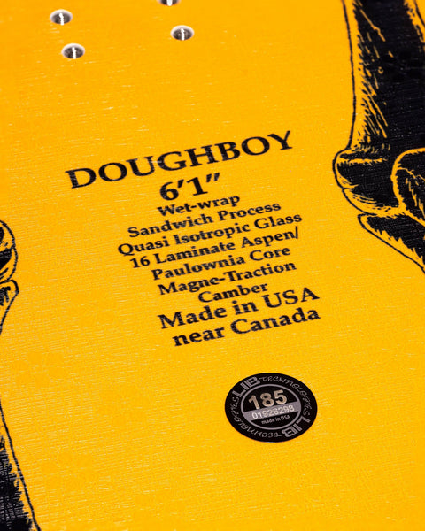 Close-up of Lib Tech Doughboy 6'1" snowboard base showing construction specs and Lib Tech logo