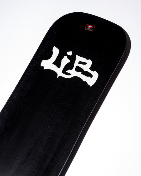 Lib Tech Skunk Ape snowboard deck close-up showing logo on black topsheet