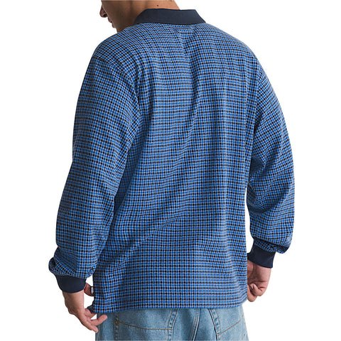 Back view of men's long sleeve plaid knit polo shirt with navy ribbed collar and cuffs